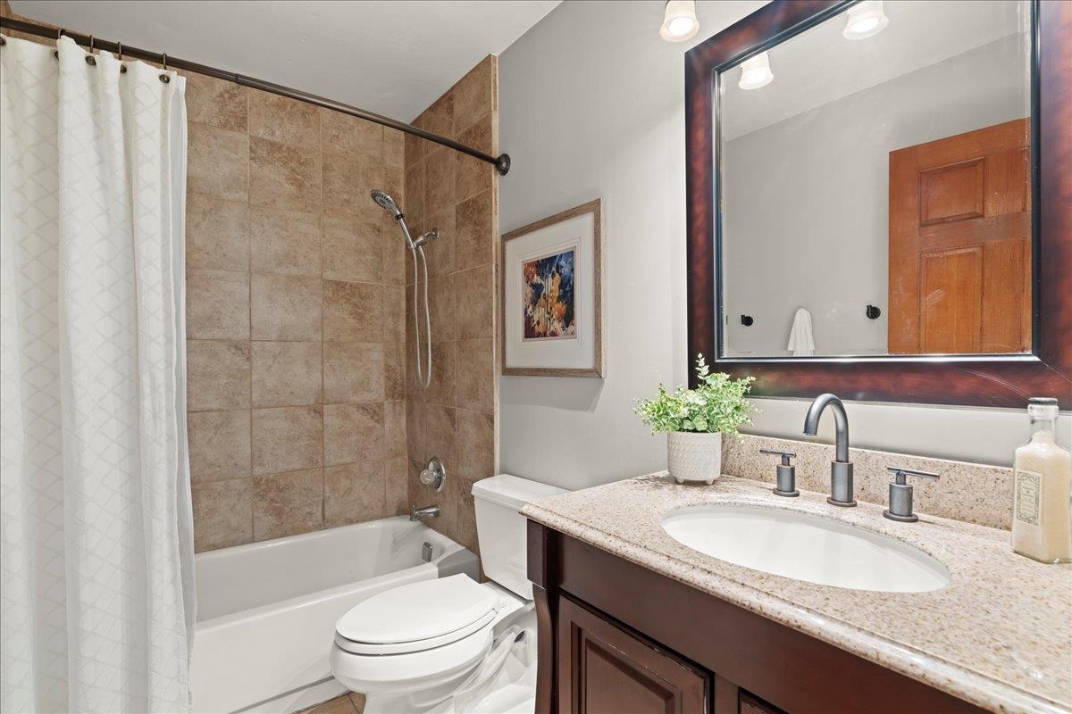 19005 Old Vineyard Road Los Gatos, CA 95033 - Photo 23 of 51 a bathroom with a granite countertop sink toilet and shower