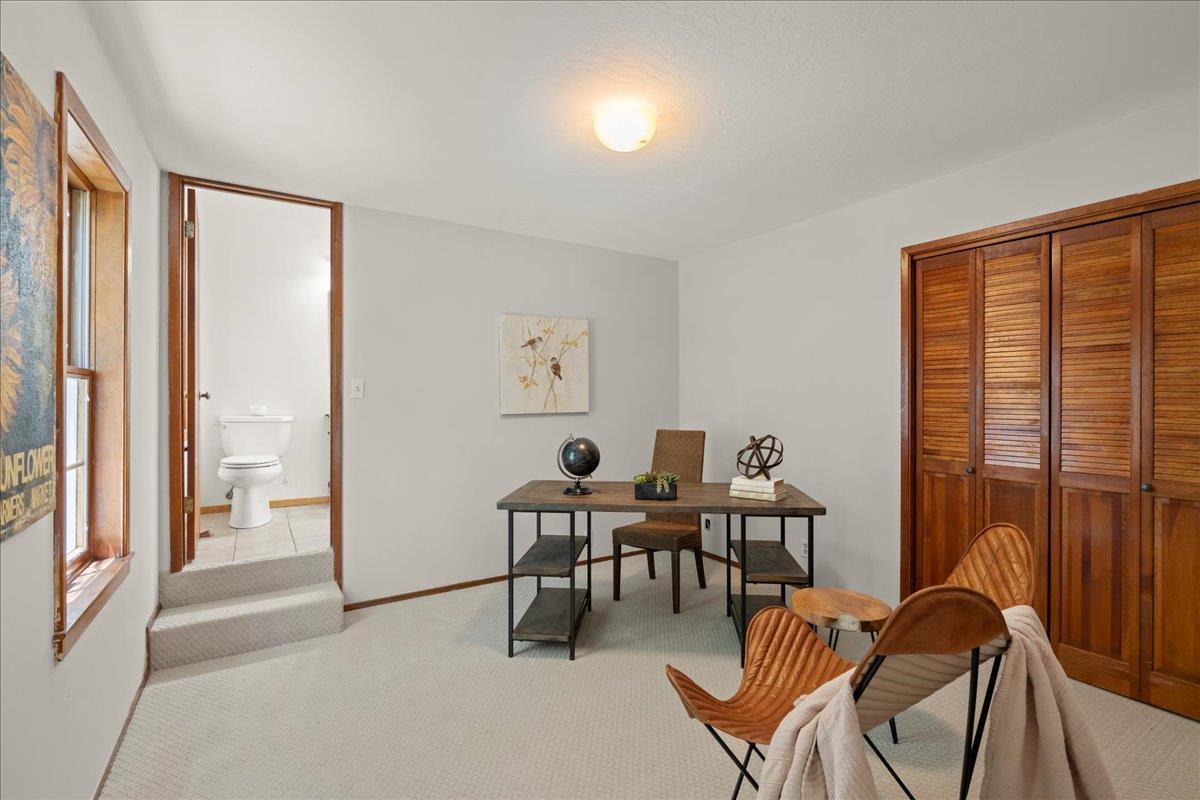 19005 Old Vineyard Road Los Gatos, CA 95033 - Photo 25 of 51 a view of a workspace with furniture and a window