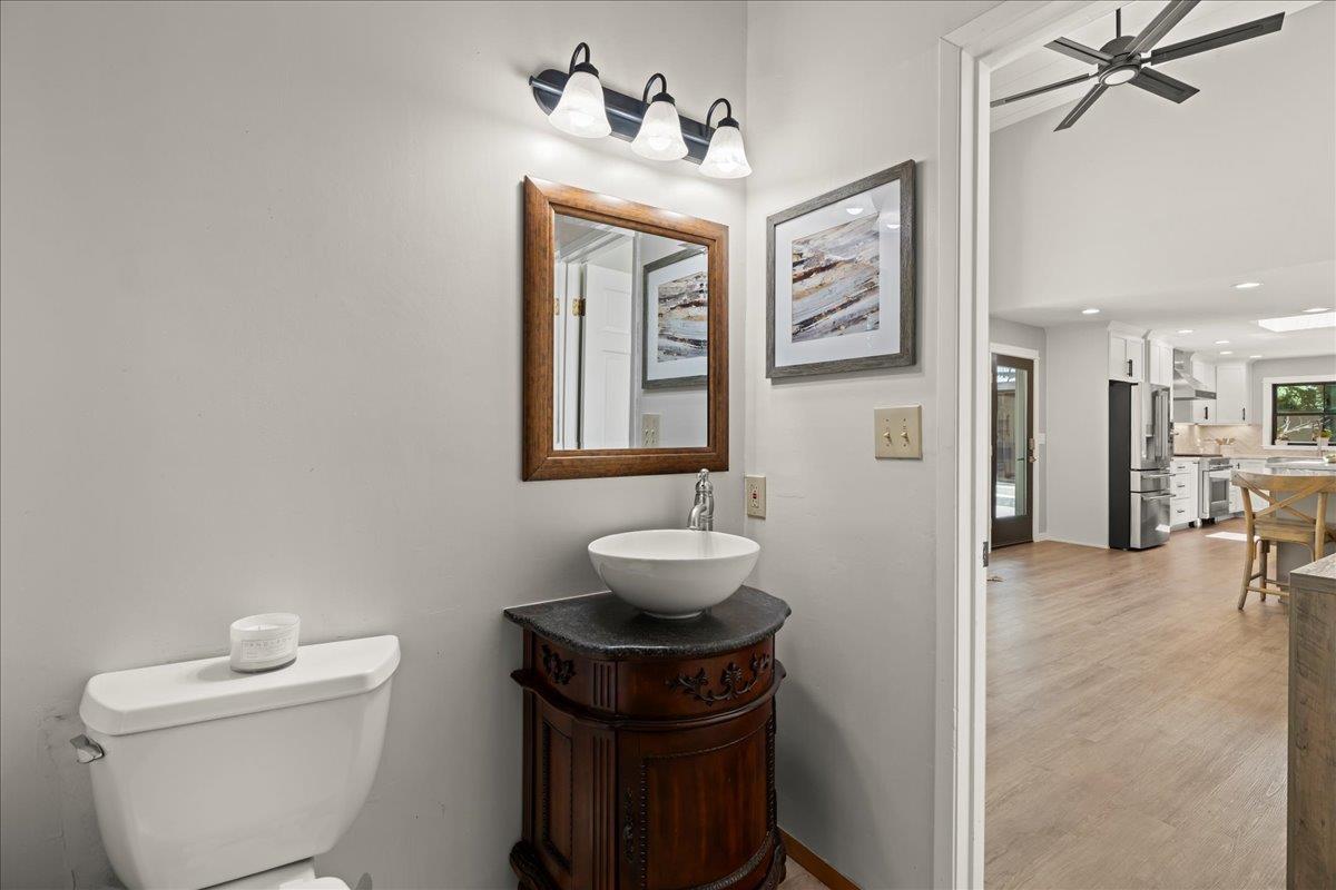 19005 Old Vineyard Road Los Gatos, CA 95033 - Photo 26 of 51 a bathroom with a toilet sink and mirror
