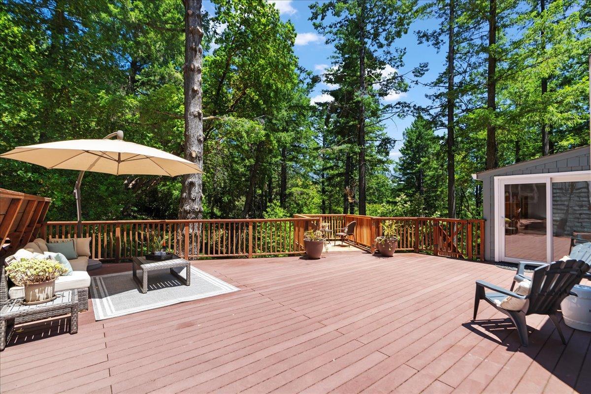 19005 Old Vineyard Road Los Gatos, CA 95033 - Photo 27 of 51 a view of balcony with outdoor seating and wooden floor
