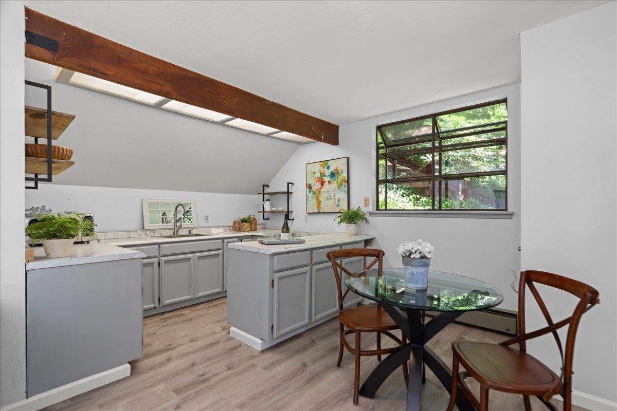 19005 Old Vineyard Road Los Gatos, CA 95033 - Photo 34 of 51 a kitchen with a table chairs sink and cabinets