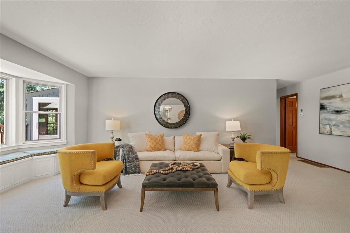 19005 Old Vineyard Road Los Gatos, CA 95033 - Photo 6 of 51 a living room with furniture a clock and a window