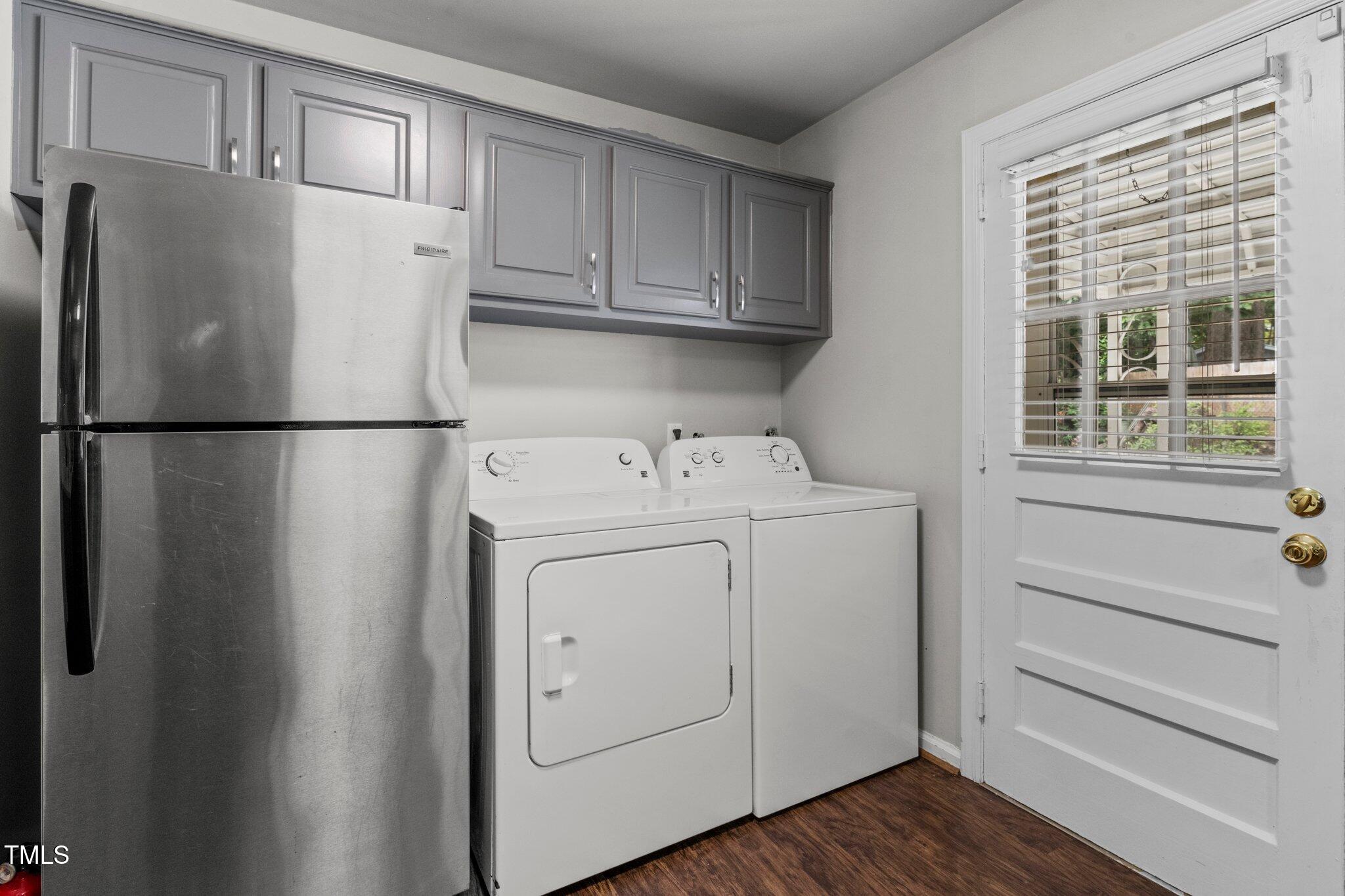 530 Banks Street Raleigh, NC 27604 - Photo 12 of 50 a white refrigerator freezer and cabinets in a kitchen