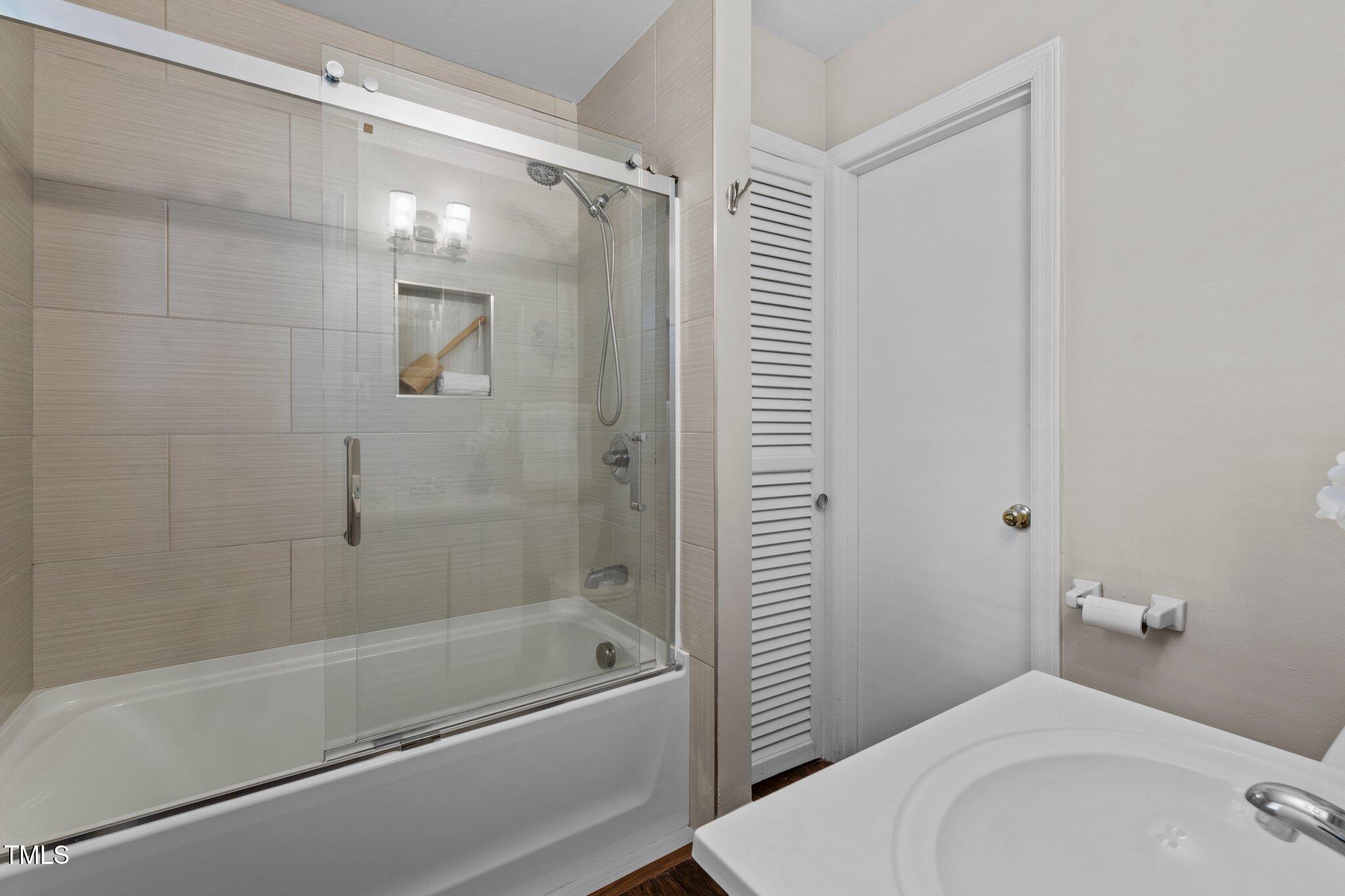 530 Banks Street Raleigh, NC 27604 - Photo 16 of 50 a bathroom with a bathtub and a shower
