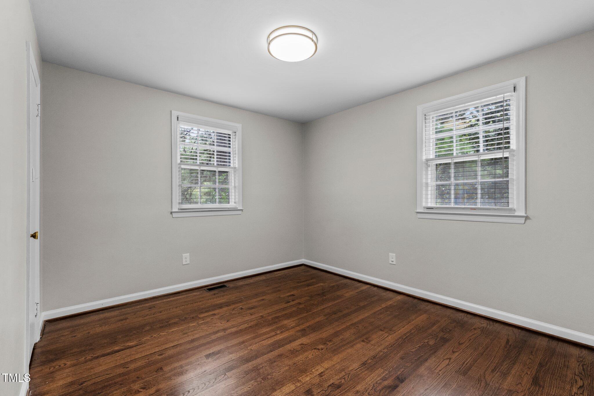 530 Banks Street Raleigh, NC 27604 - Photo 19 of 50 a view of a room with wooden floor and windows