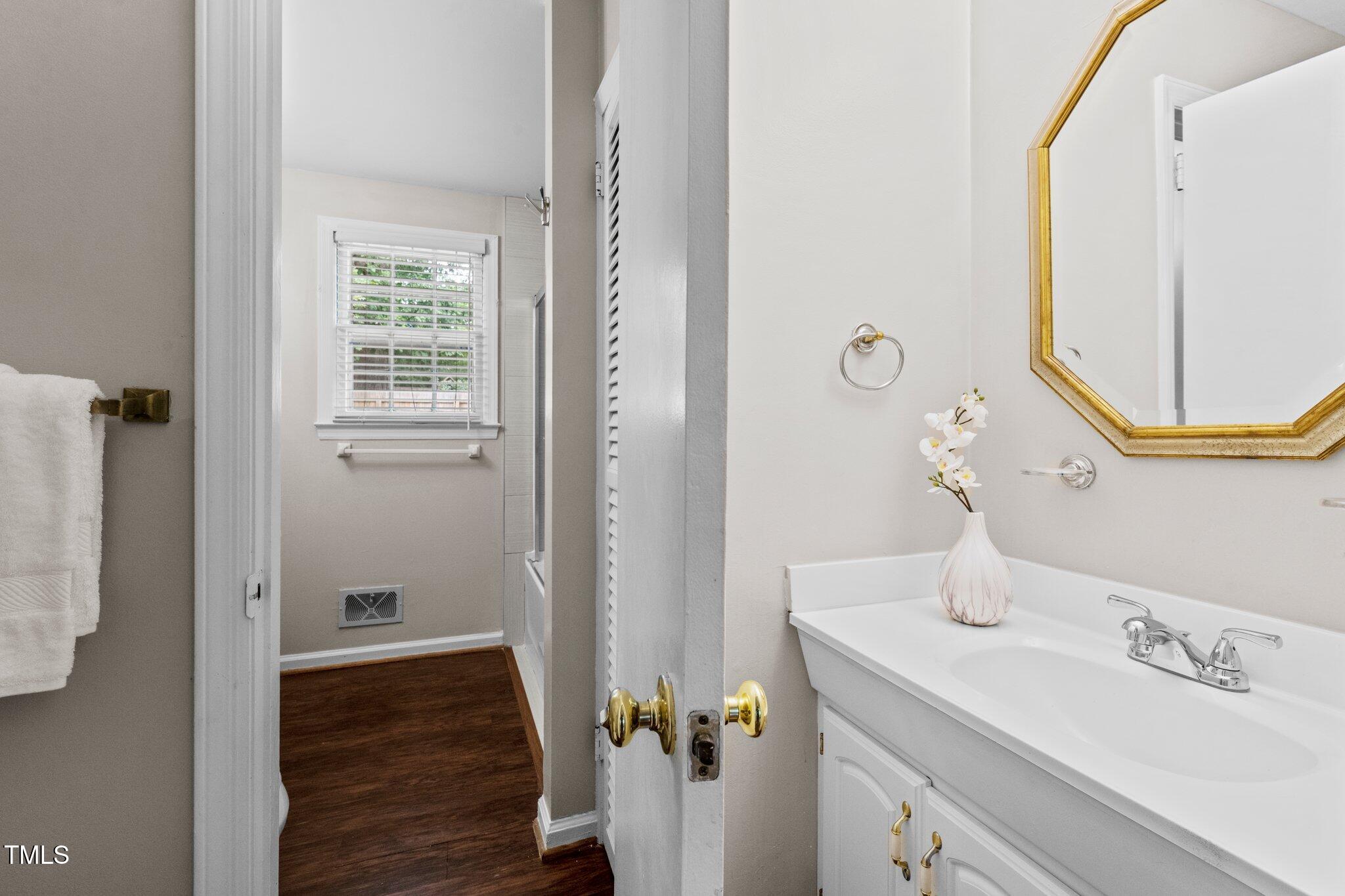 530 Banks Street Raleigh, NC 27604 - Photo 20 of 50 a bathroom with a sink and a mirror