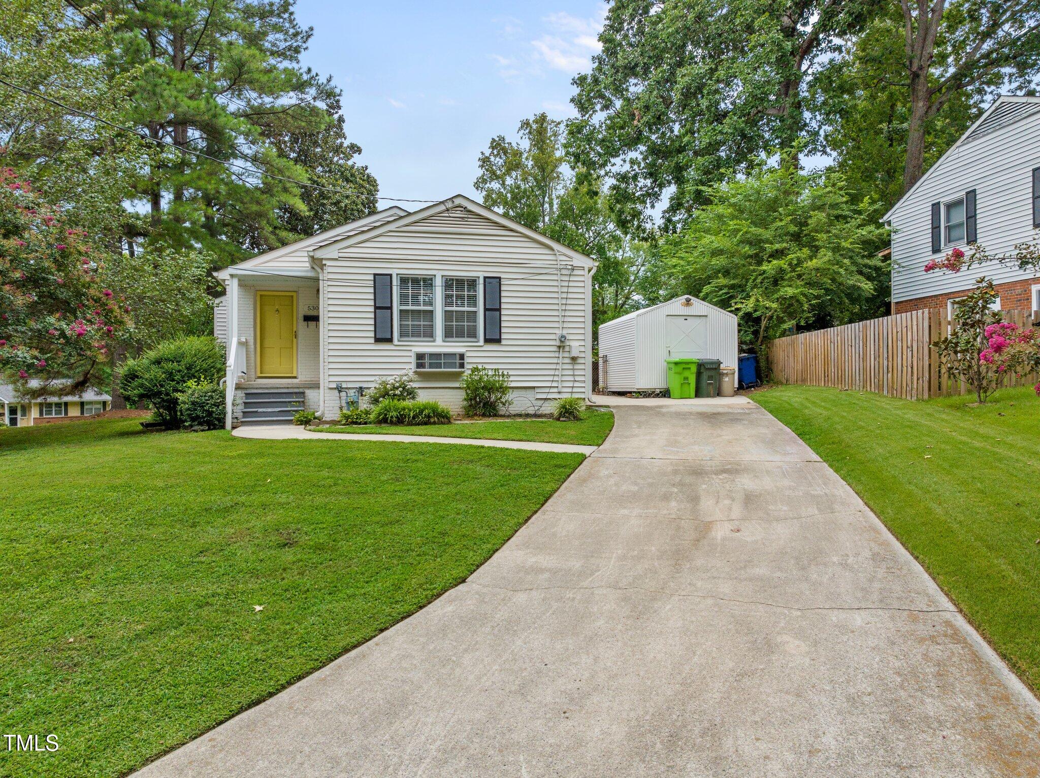 530 Banks Street Raleigh, NC 27604 - Photo 22 of 50 a front view of a house with a yard