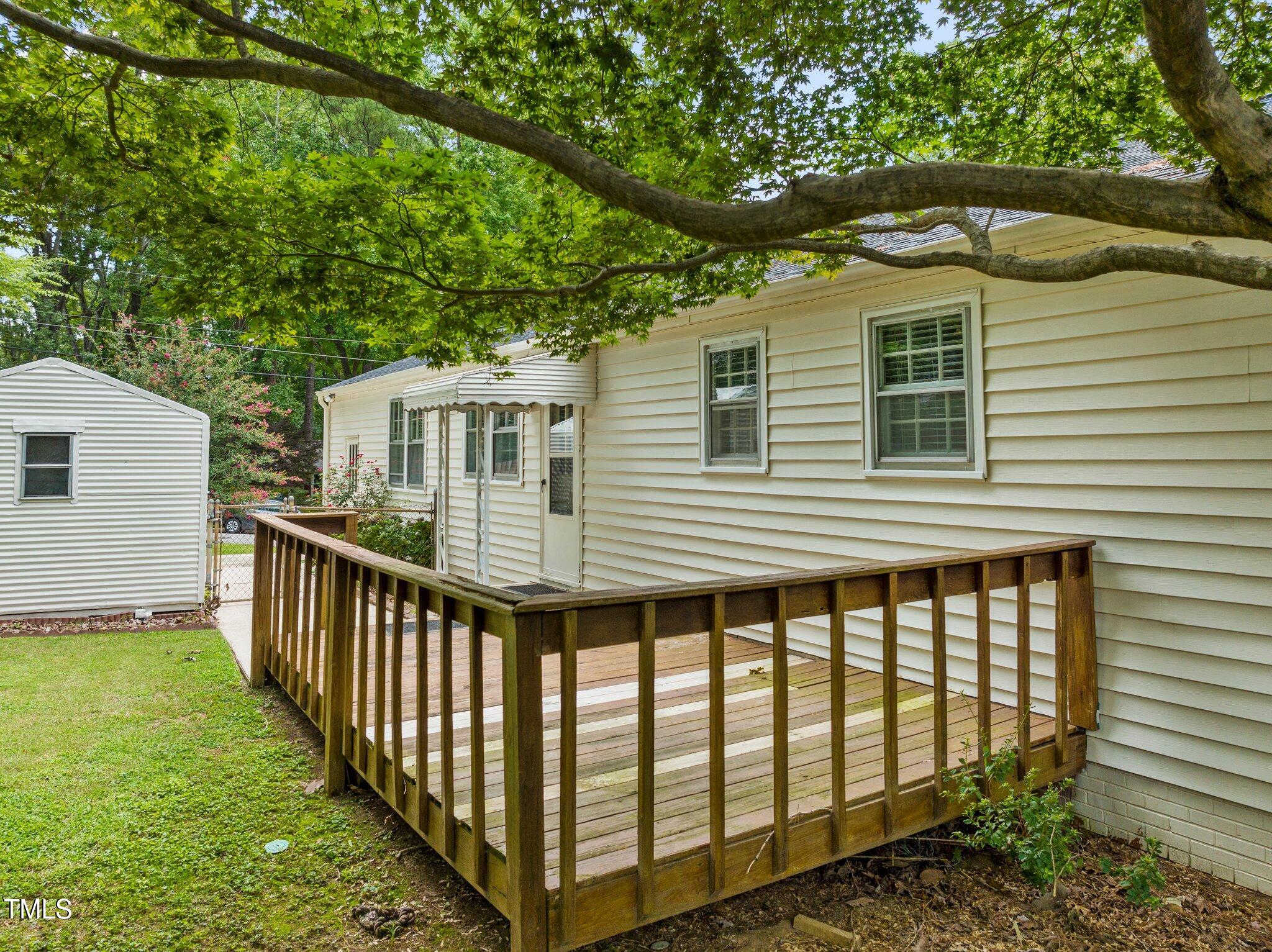 530 Banks Street Raleigh, NC 27604 - Photo 25 of 50 a view of a house with backyard and deck
