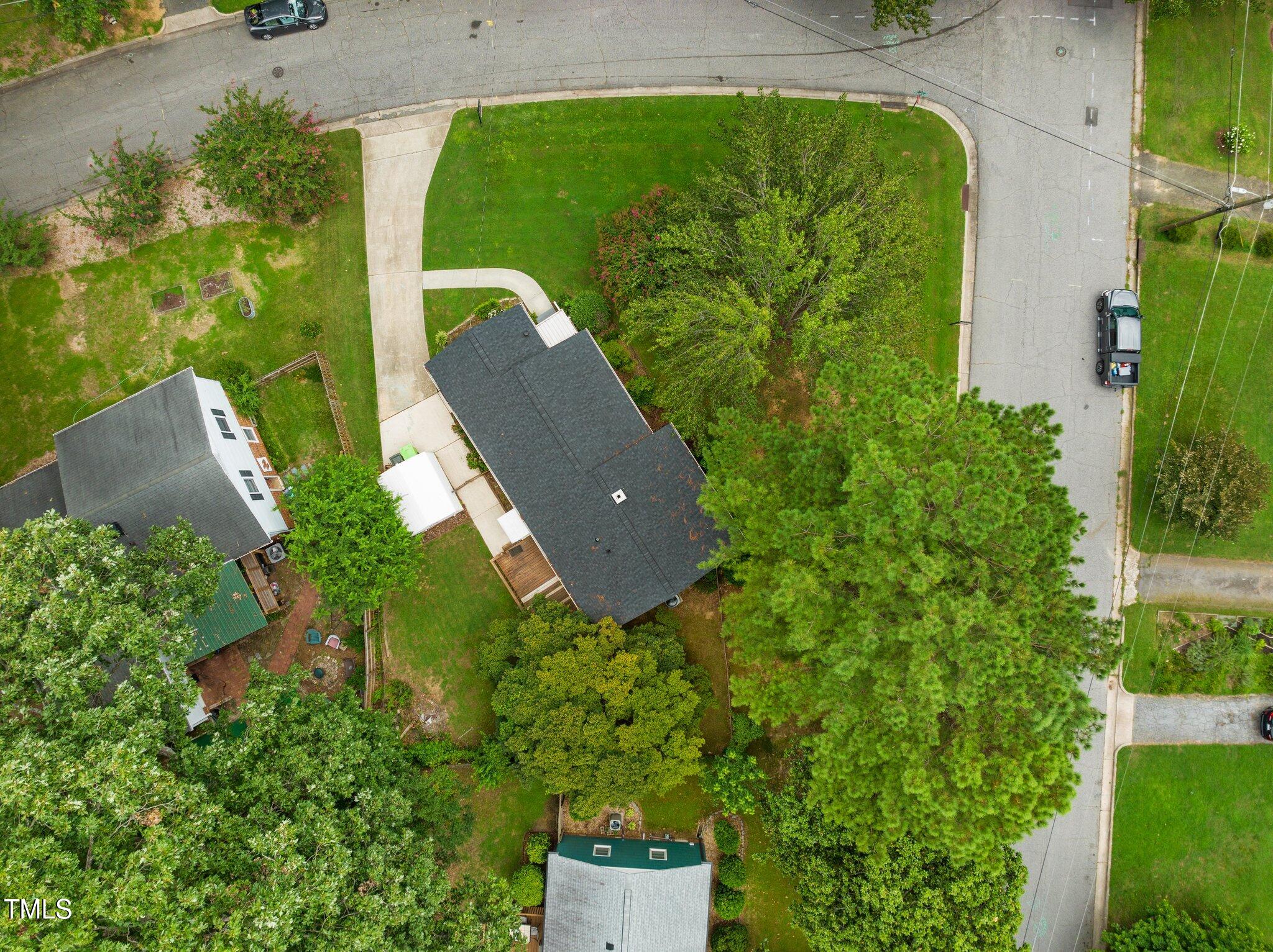 530 Banks Street Raleigh, NC 27604 - Photo 34 of 50 an aerial view of a house with a yard