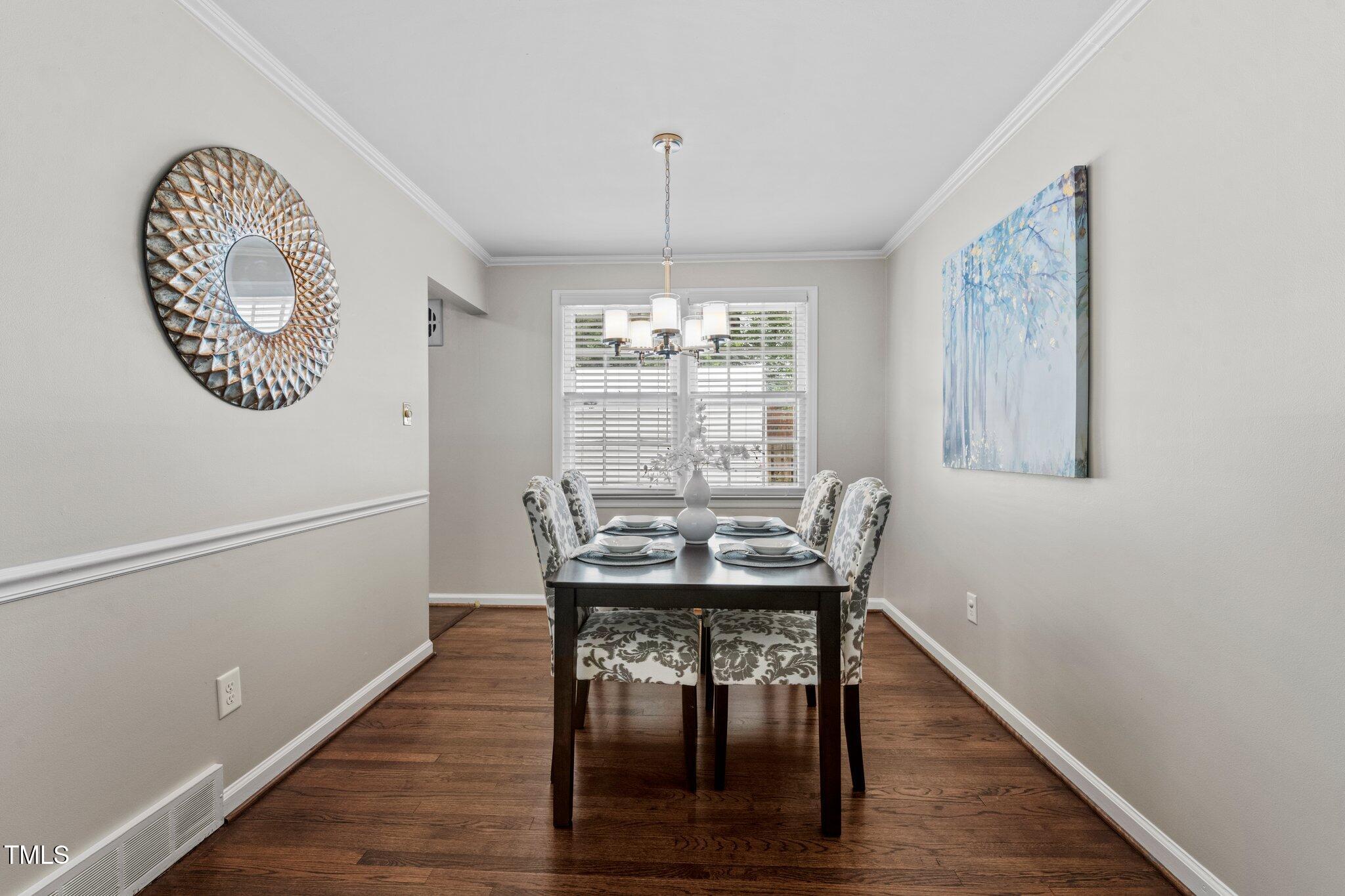 530 Banks Street Raleigh, NC 27604 - Photo 7 of 50 a view of a dining room with furniture window and wooden floor