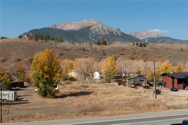 a view of houses with a road and a mountain view