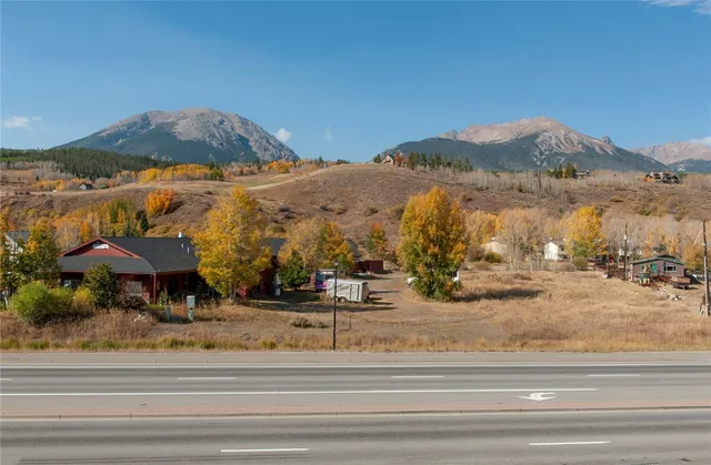 a view of a town with mountains in the background