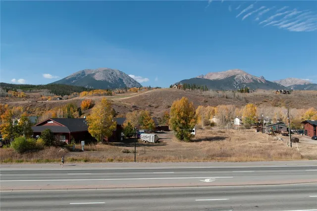 a view of a town with mountains in the background