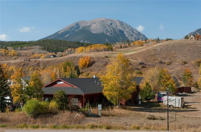 a view of a town with mountains in the background