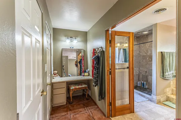 a view of a hallway with living room and furniture