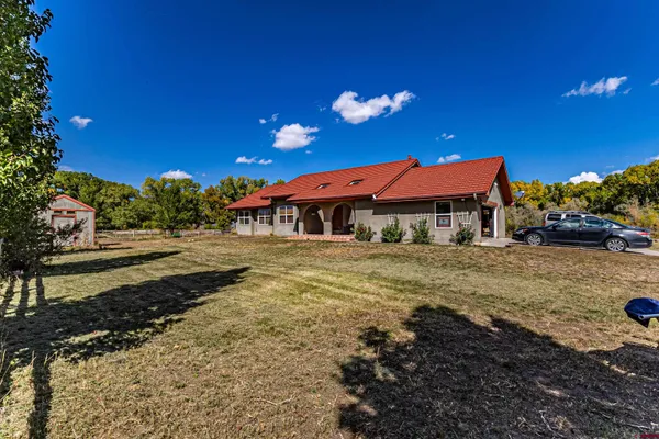 a view of a building with a yard