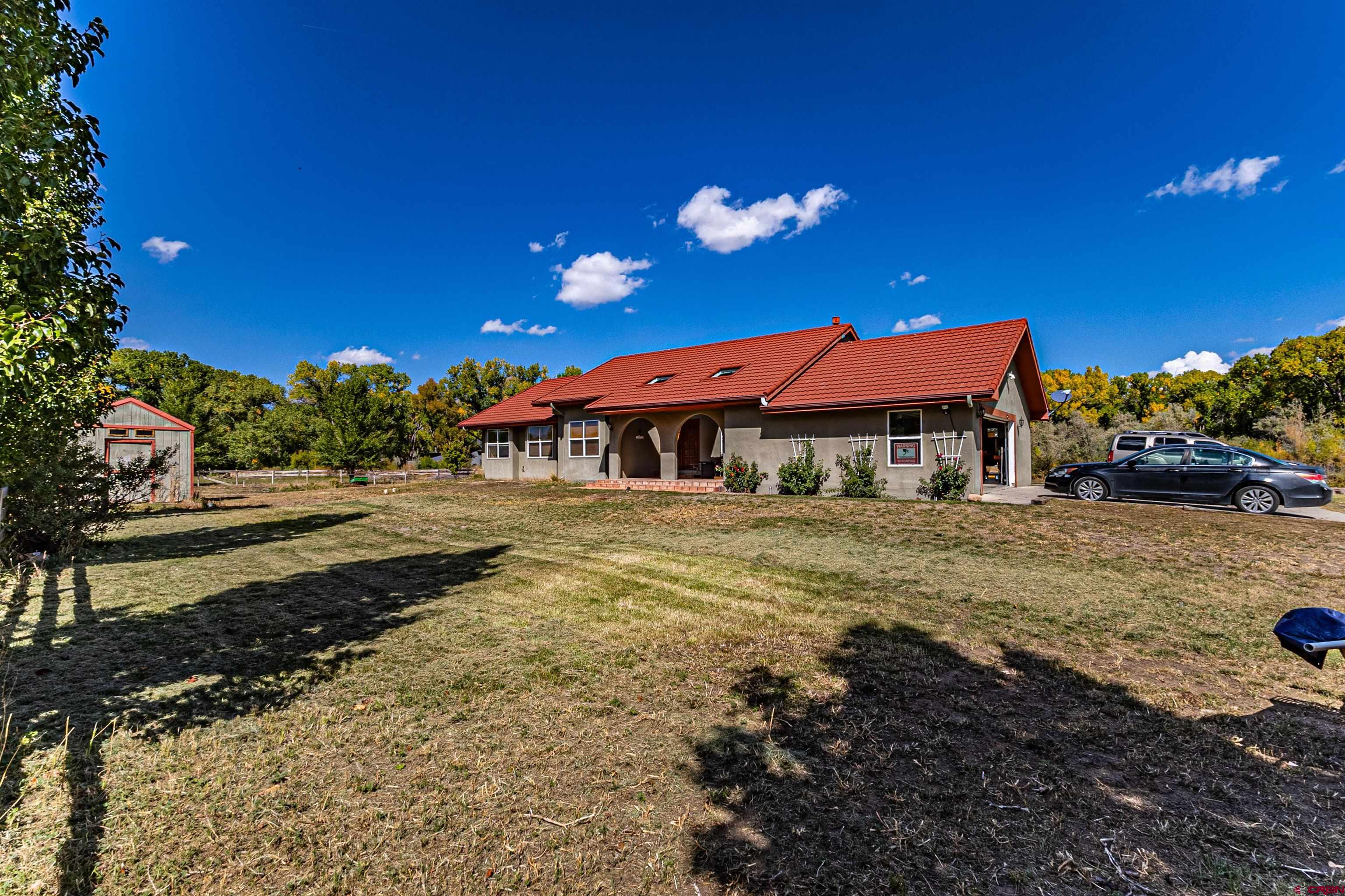 18 Road 2617 Aztec, NM 87410 - Photo 32 of 45 a view of a building with a yard
