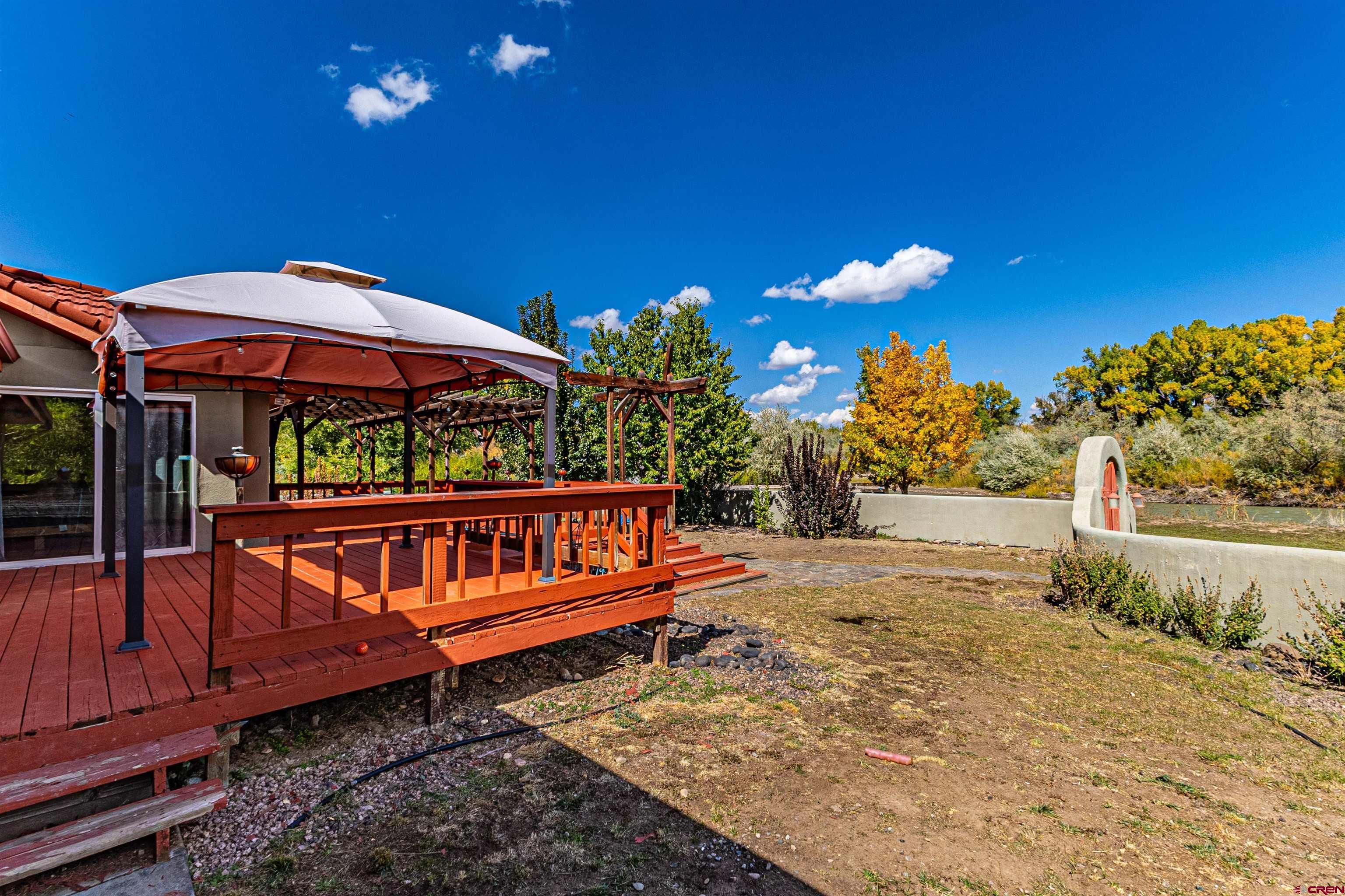 18 Road 2617 Aztec, NM 87410 - Photo 33 of 45 a backyard of a house with yard and outdoor seating