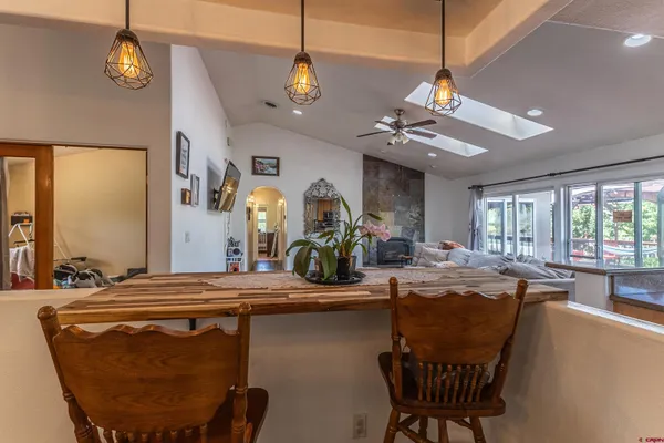 a view of a dining room with furniture window and outside view
