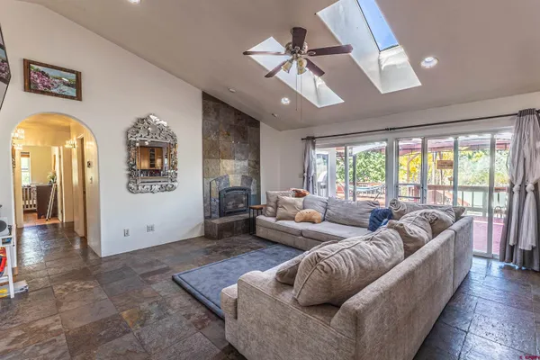 a living room with furniture and a large window