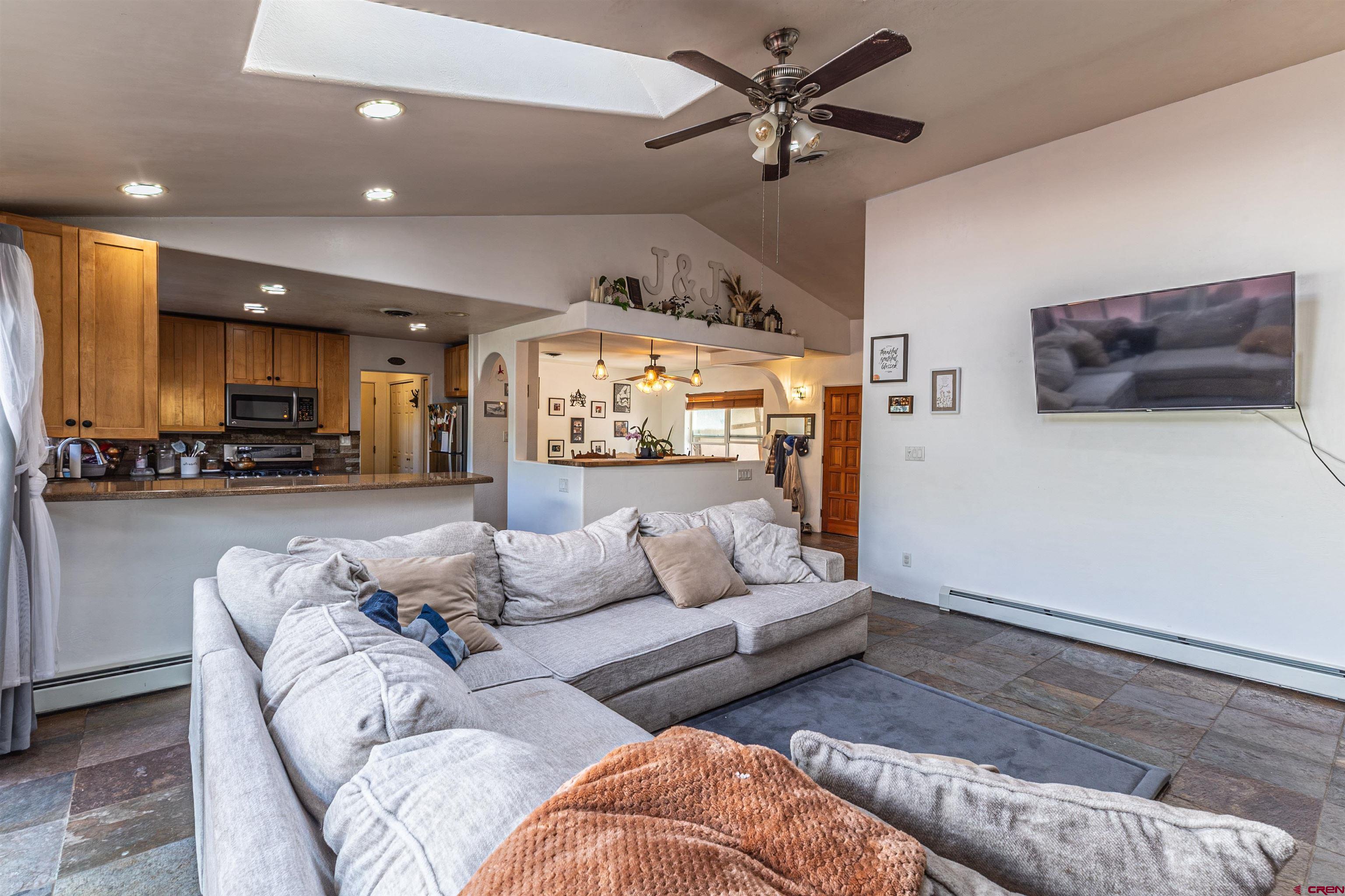 18 Road 2617 Aztec, NM 87410 - Photo 9 of 45 a living room with furniture and a view of kitchen
