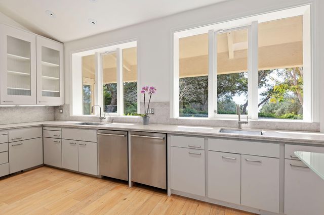 a kitchen with appliances and cabinets