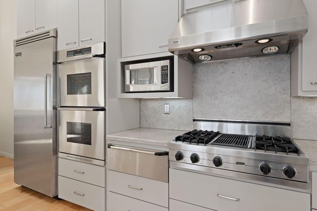 a bathroom with a sink and a shower