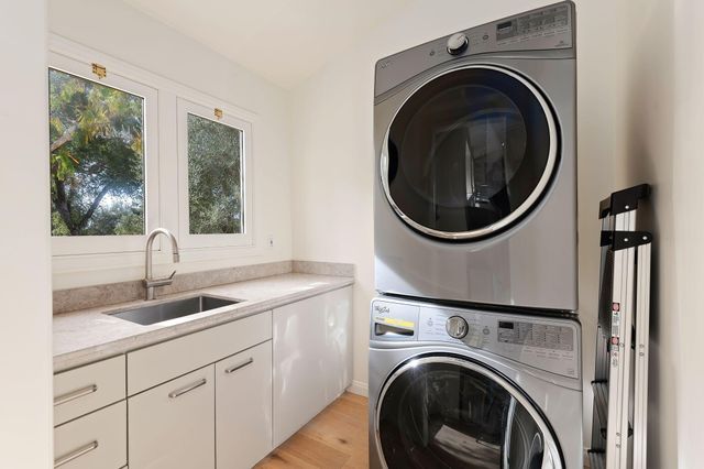 a kitchen with a sink and large window
