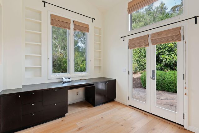 a view of a patio with table and chairs and potted plants