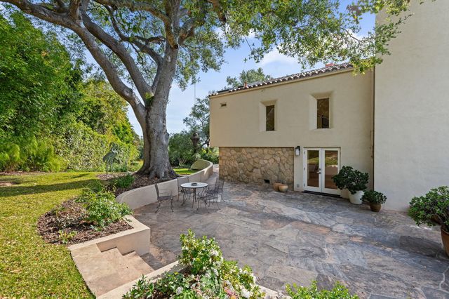 a view of backyard with large trees
