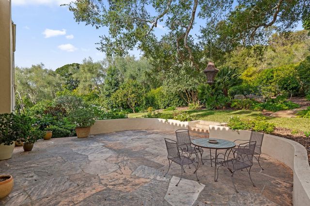a bedroom with a bed couch and a window