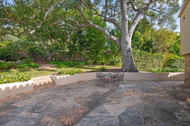 a bathroom with a shower sink and mirror