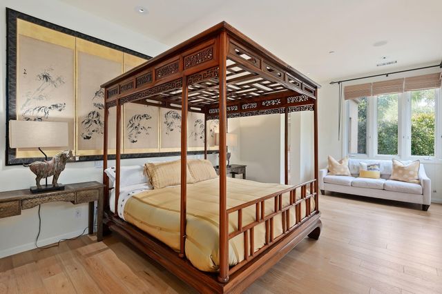a bathroom with a granite countertop sink a mirror and a shower