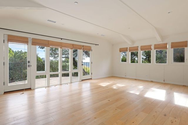 a bathroom with a double vanity sink mirror and shower
