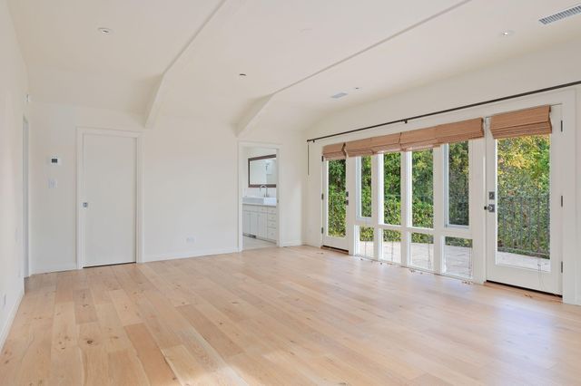 a view of a balcony with a tree