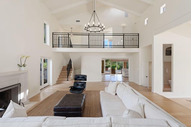 a view of wooden floor and windows in a room