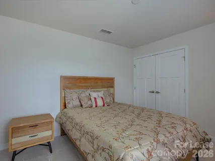 a bedroom with a bed and a cabinets