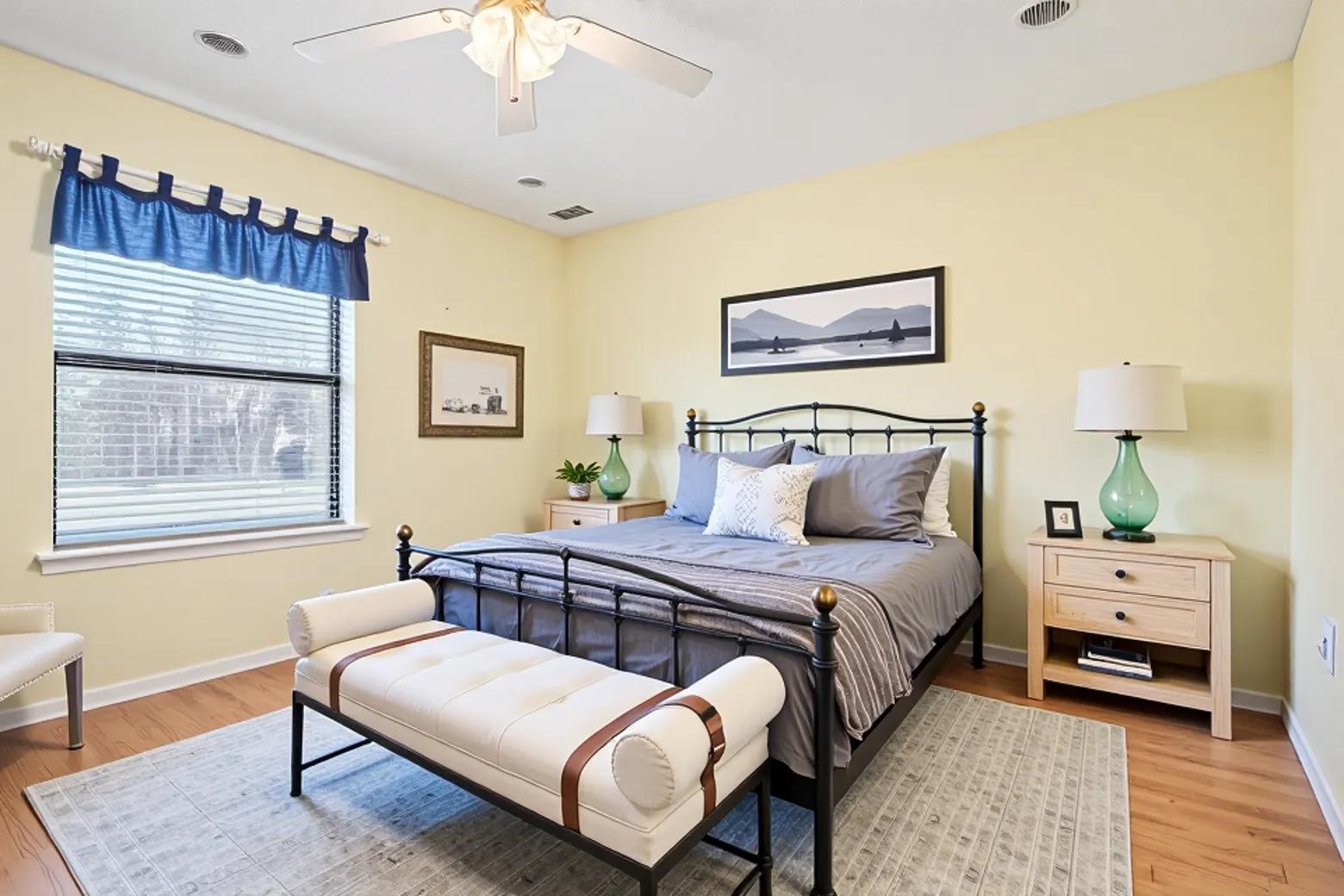 20 Saddle Rock Ridge Street Wimberley, TX 78676 - Photo 20 of 40 a bedroom with a bed and a chandelier