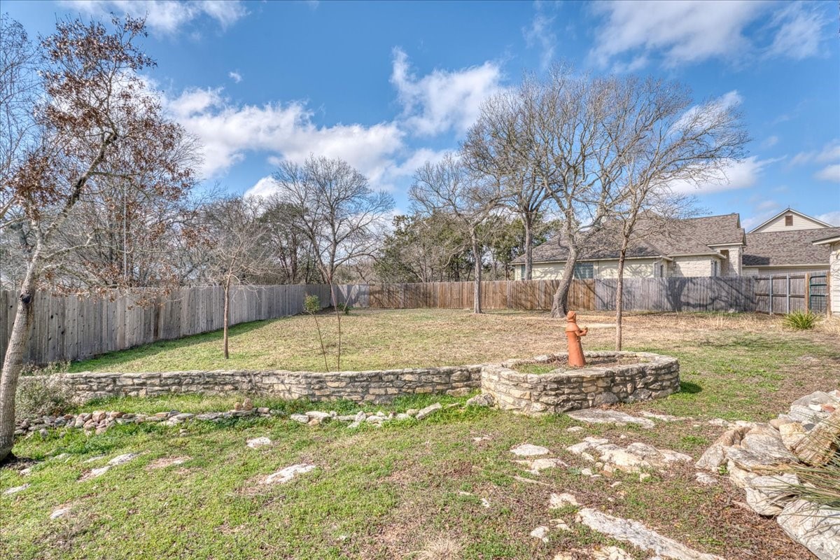 20 Saddle Rock Ridge Street Wimberley, TX 78676 - Photo 33 of 40 a view of a yard with trees