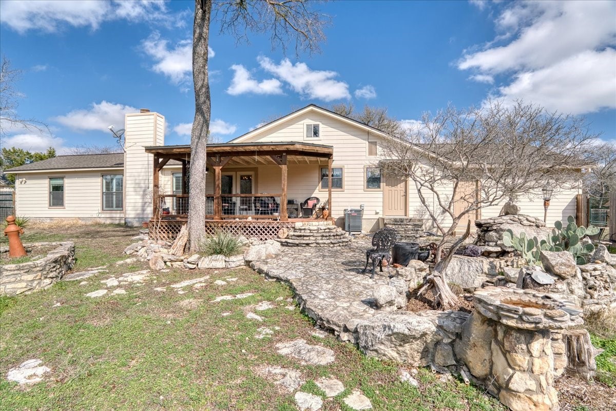 20 Saddle Rock Ridge Street Wimberley, TX 78676 - Photo 34 of 40 a view of a house with a yard