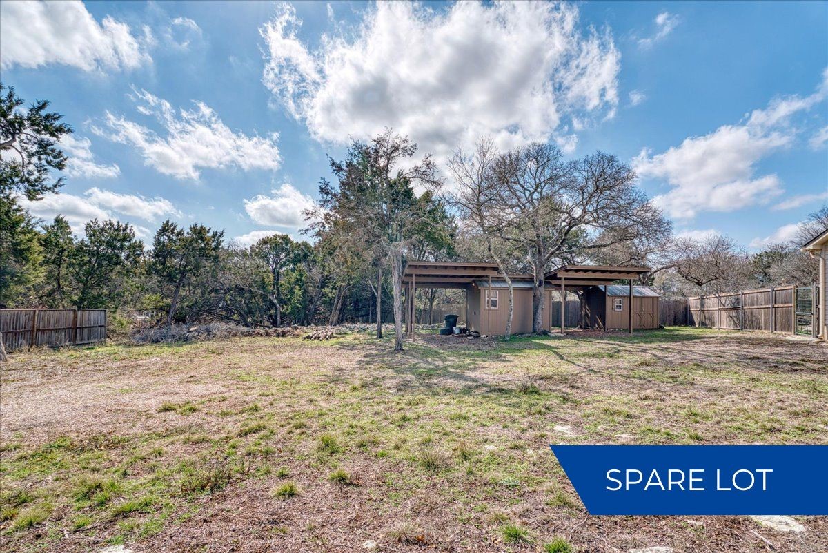 20 Saddle Rock Ridge Street Wimberley, TX 78676 - Photo 39 of 40 a view of a dry yard with large trees