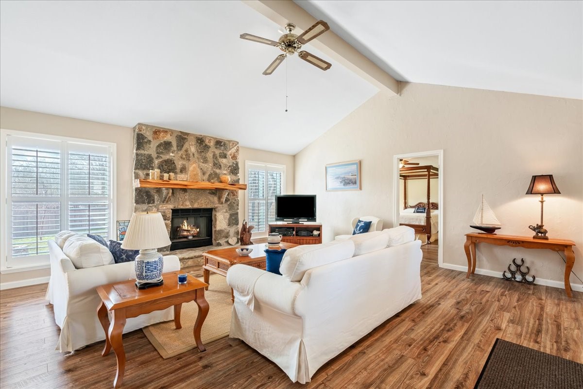 20 Saddle Rock Ridge Street Wimberley, TX 78676 - Photo 8 of 40 a living room with furniture and a fireplace
