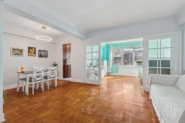 a living room with furniture and large window