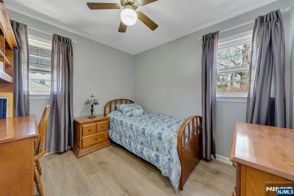 a bed room with a bed and a chandelier