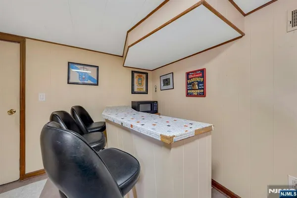 a workspace with furniture and ceiling fan