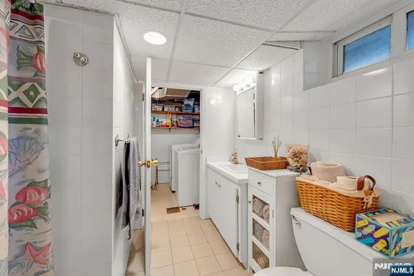 a kitchen with stainless steel appliances a refrigerator and a stove