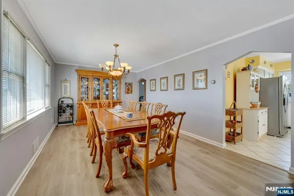 a view of a dining room with furniture and window