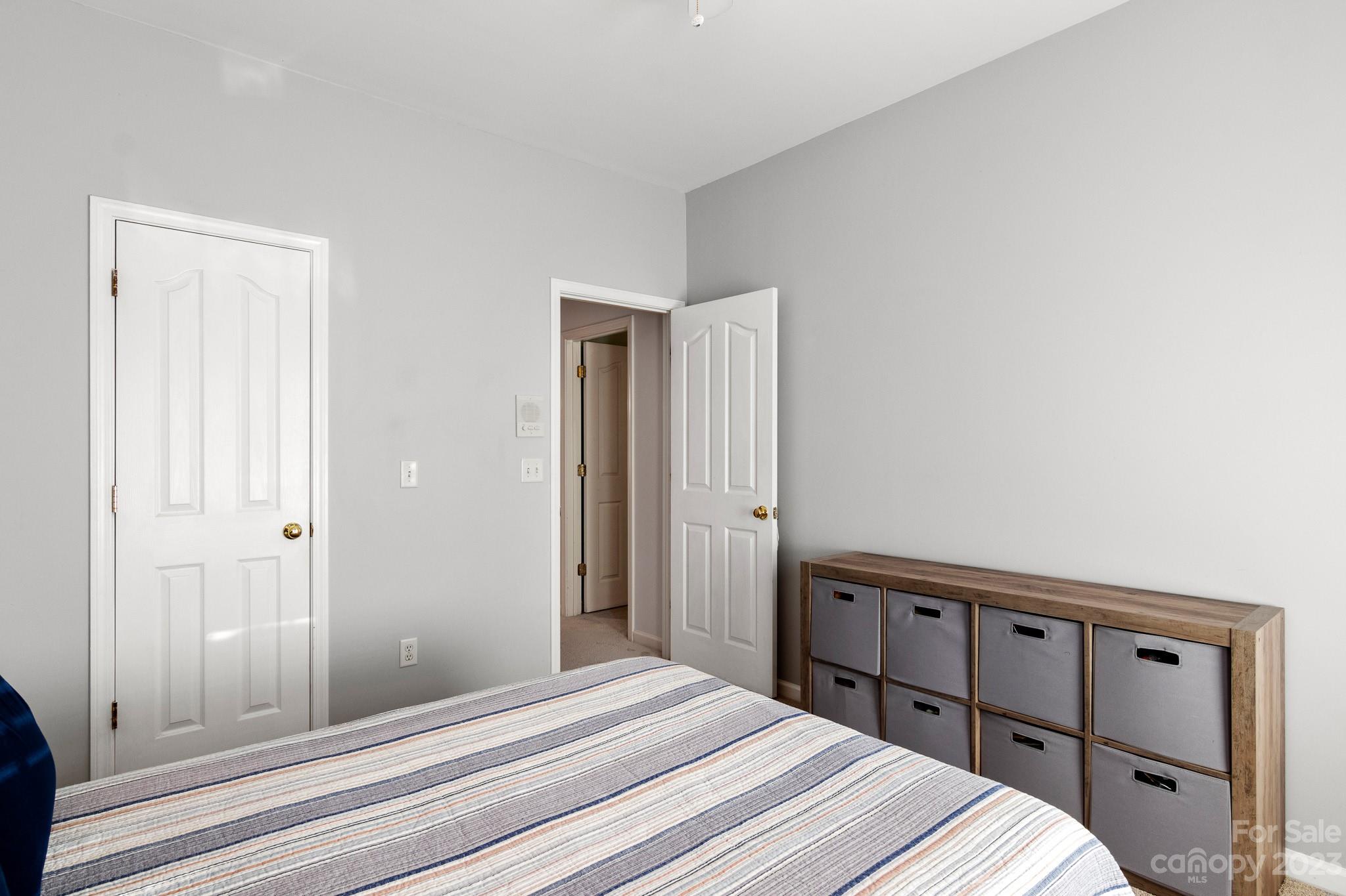 741 Knightswood Road Fort Mill, SC 29708 - Photo 38 of 47 a bedroom with a bed and a mirror