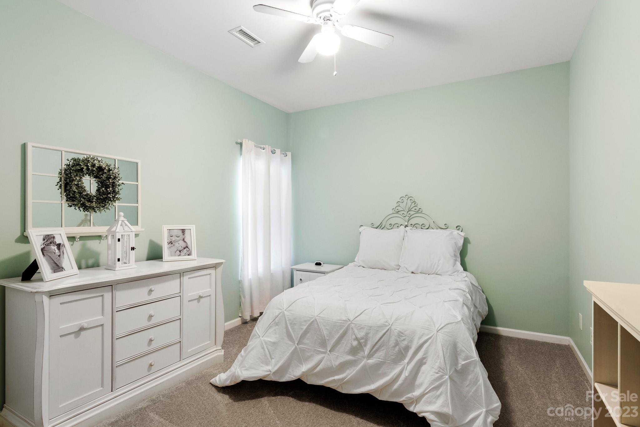 741 Knightswood Road Fort Mill, SC 29708 - Photo 39 of 47 a bedroom with a bed and a dresser