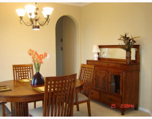 7526 Bell Isle Corpus Christi, TX 78414 - Photo 4 of 7 a view of a dining room with furniture and wooden floor